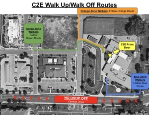 An aerial map of the C2E parking lot and neighboring roads and buildings. The map shows the approved walking routes for both arriving to school and for pickup or walk off after school. The map indicated three potential routes: the blue route is for walkers approaching the school from the east on the northern sidewalk of Carlson Drive, the green route is for walkers who are approaching the school from the west using an access road, and the orange route is for students approaching the school from the north. The map informs users that they are not permitted to drop off, pick up, or park anywhere on Carlson Drive.